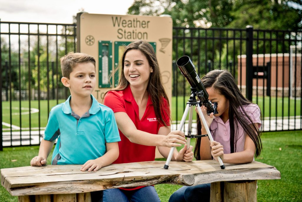 Kiddie Academy teacher STEM activity with students